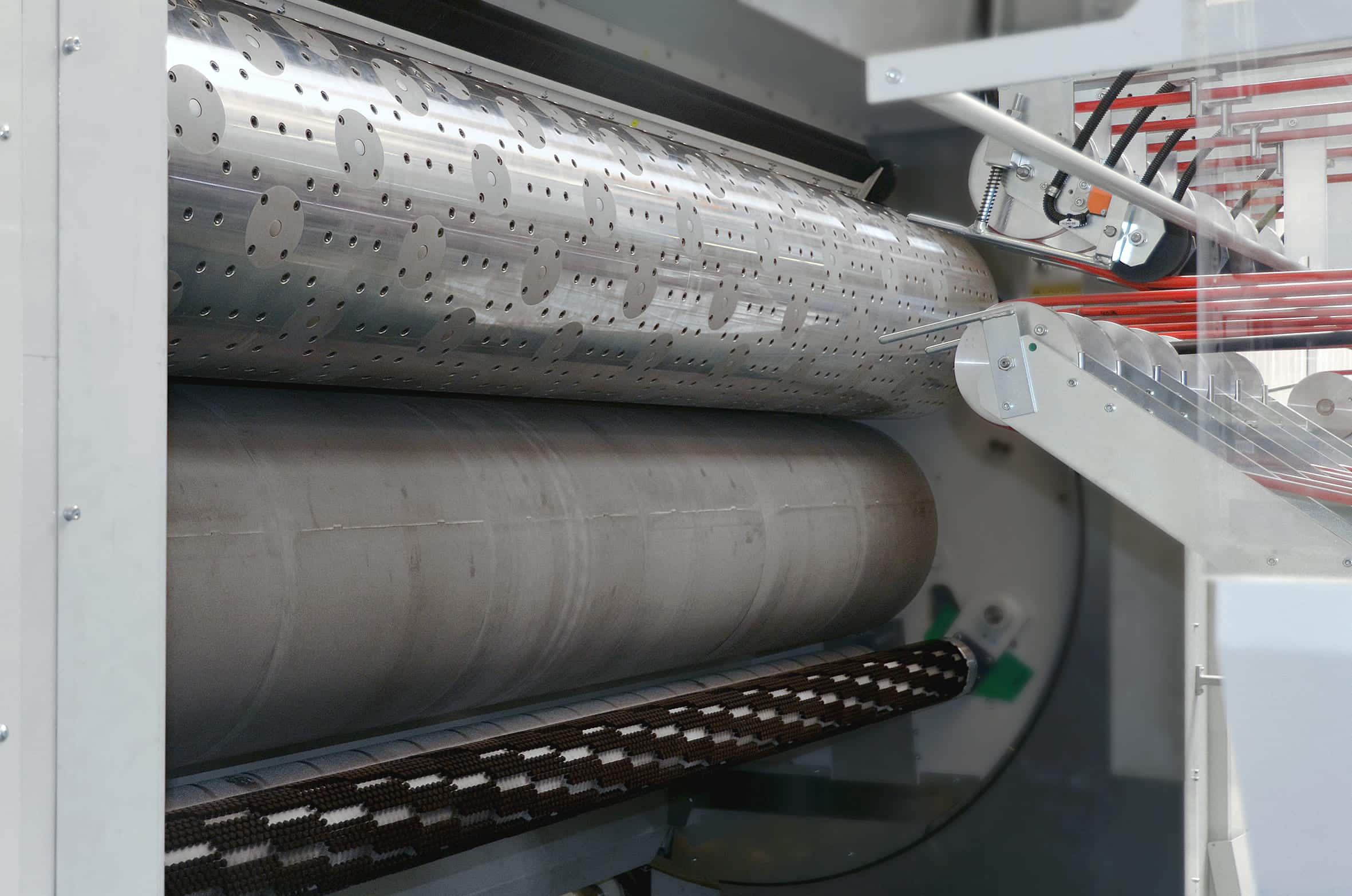 Industrial machinery with rollers and mechanisms